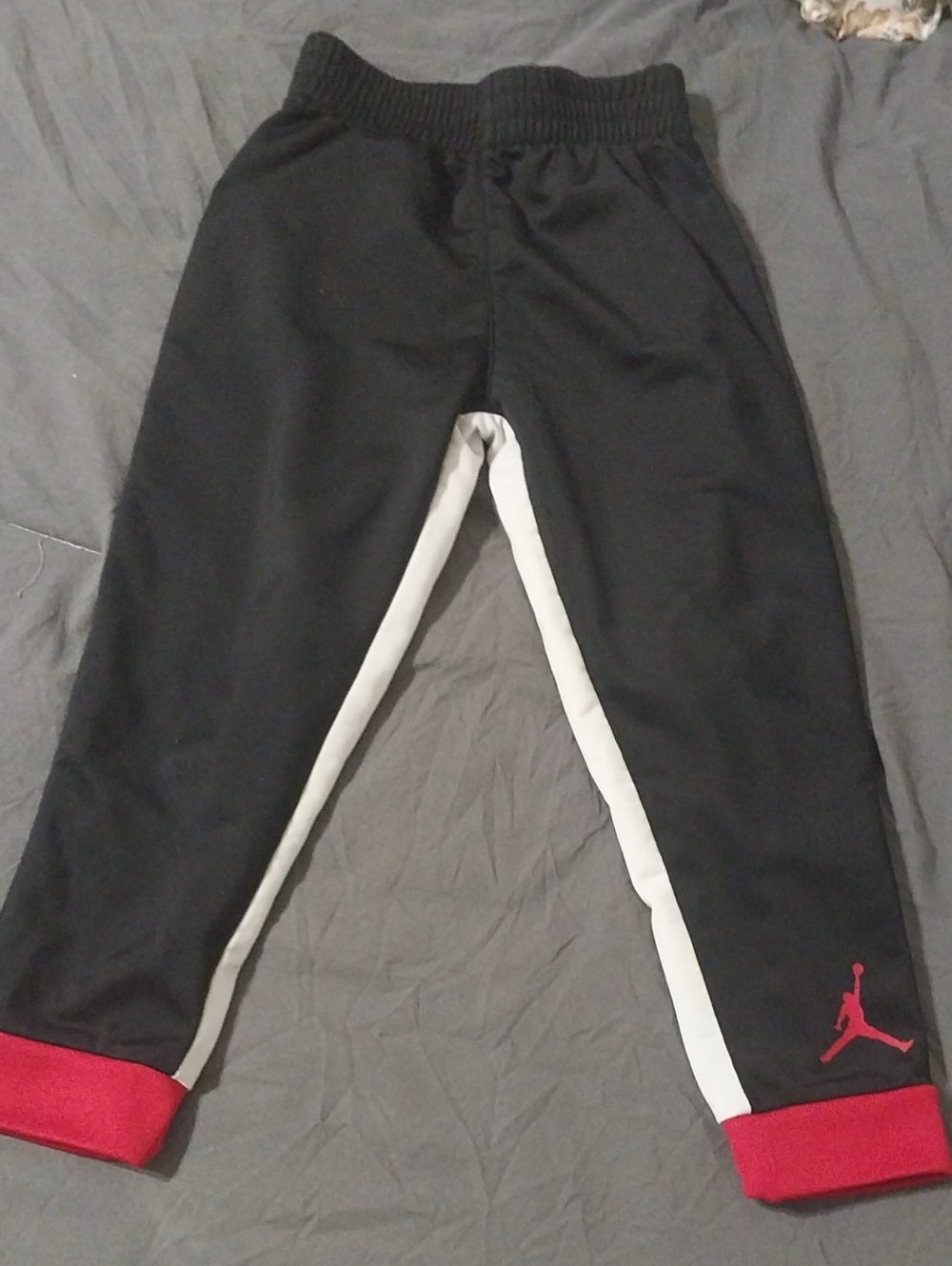 Jordan Black Toddler Sweatpants with White Side Stripe and Red Cuffs
